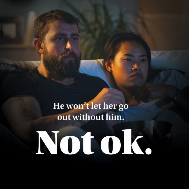 Poster text reads “He won’t let her go out without him. Not ok.” — campaign about possessiveness and control.