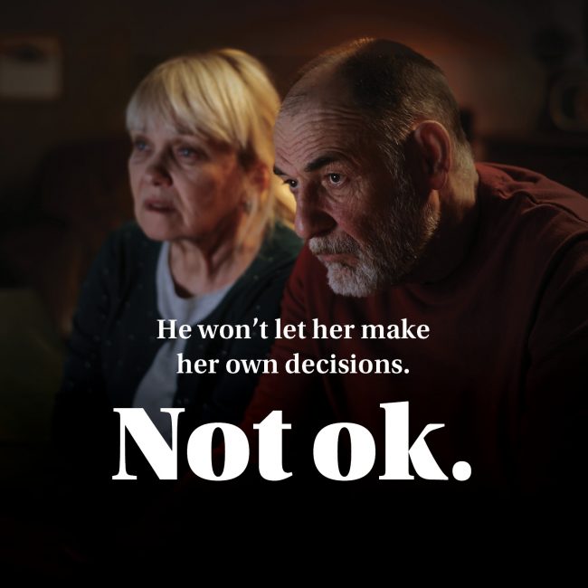 Poster text reads “He won’t let her make her own decisions. Not ok.” — campaign about loss of autonomy.